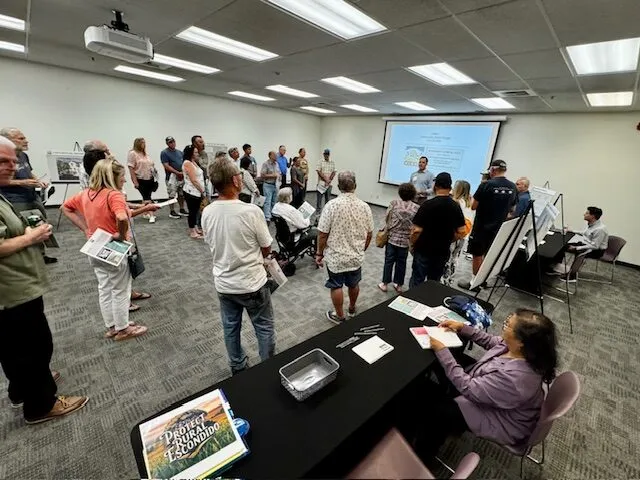Neighbors gathered at a Aldea Escondido developer sponsored open house on June 18, 2025. 